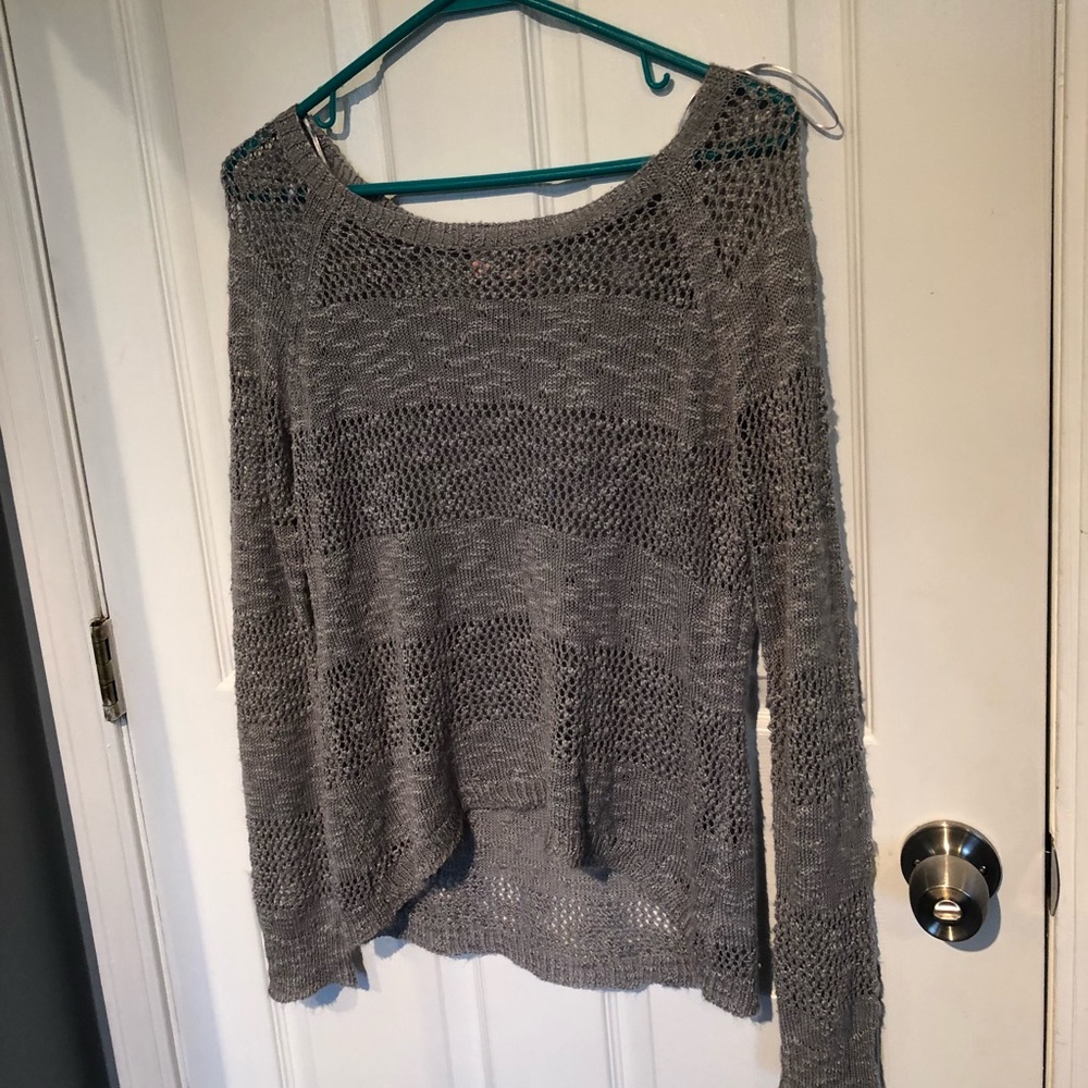 Grey knitted sweater with holes